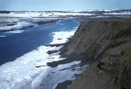Embankment along a river, melting and quickly eroding. A good example of sun's warm rays on perma...
